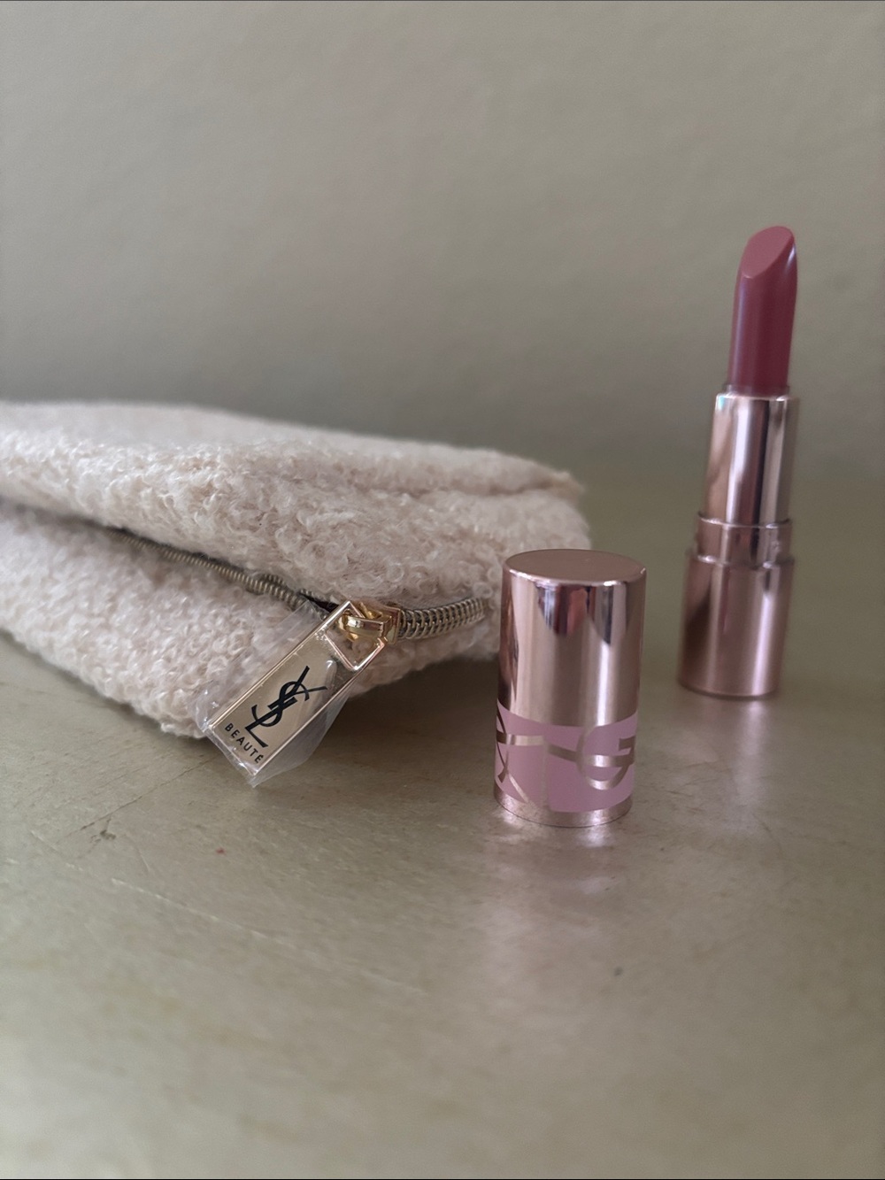 Yves Saint Laurent Candy Glow # 44 B lip balm and a small YSL bag